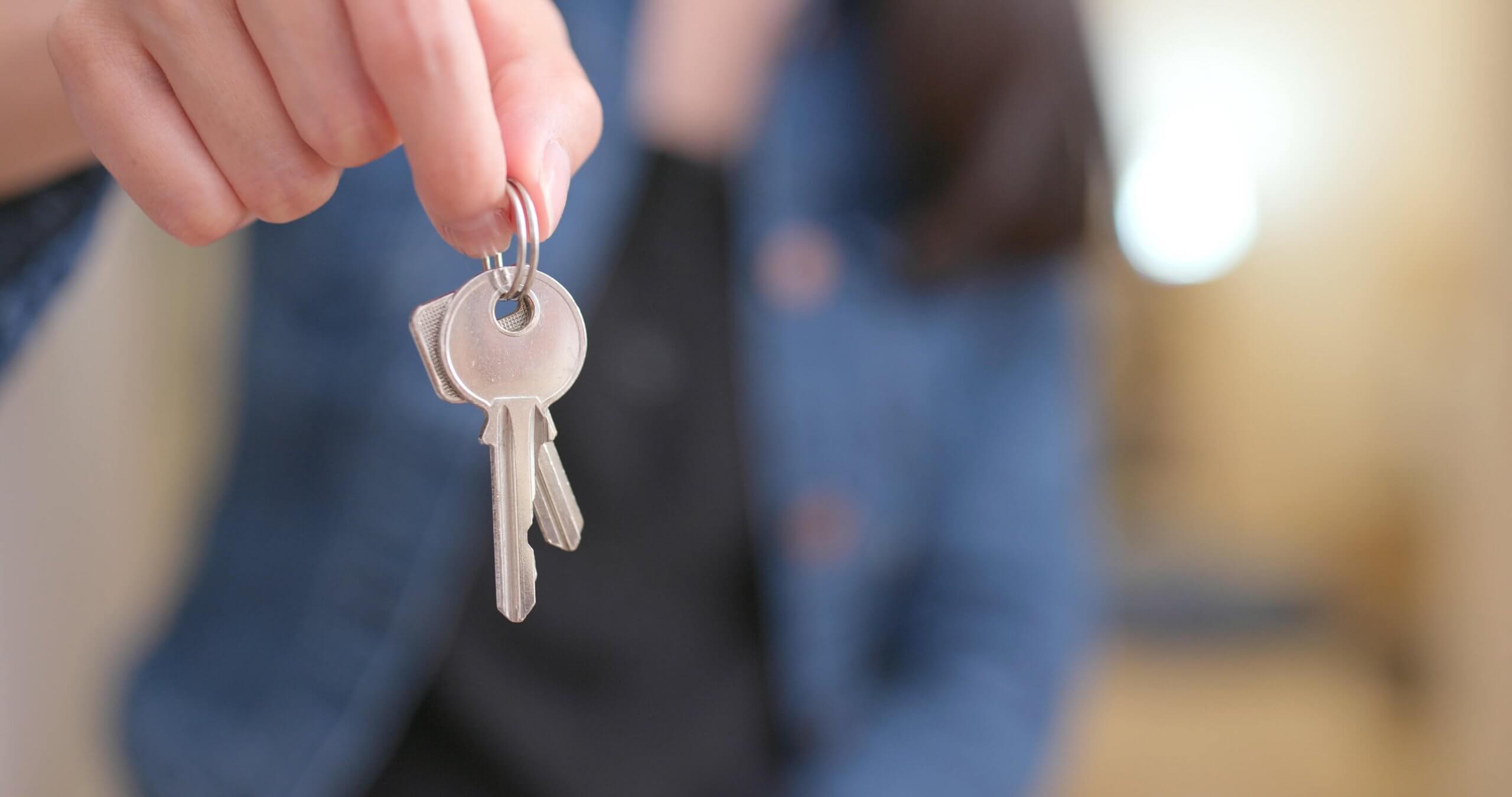 woman-holding-key-2021-08-29-08-15-19-utc
