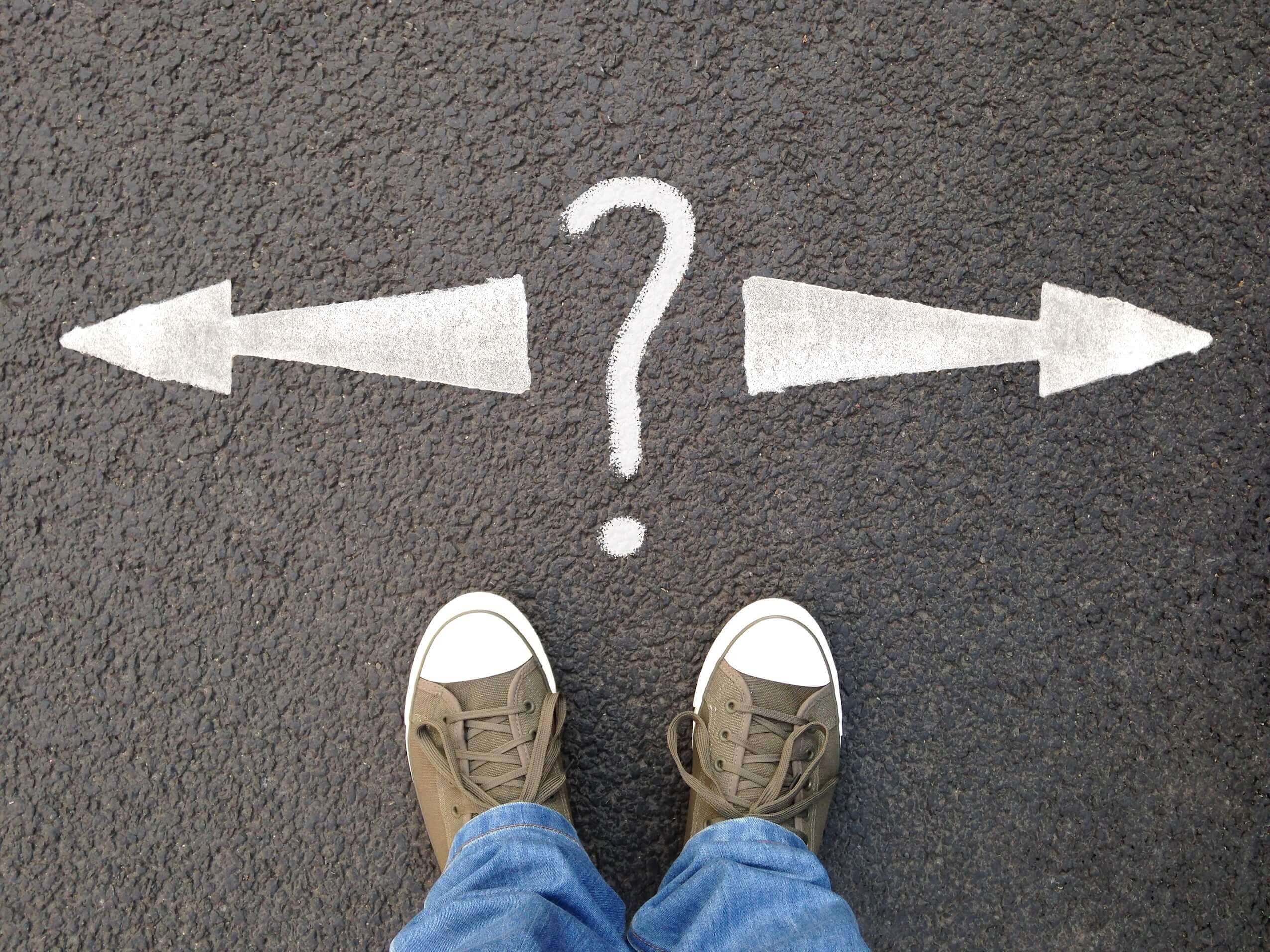 feet-standing-on-street-with-road-markings-questi-2021-09-04-03-19-42-utc feet-standing-on-street-with-road-markings-questi-2021-09-04-03-19-42-utc