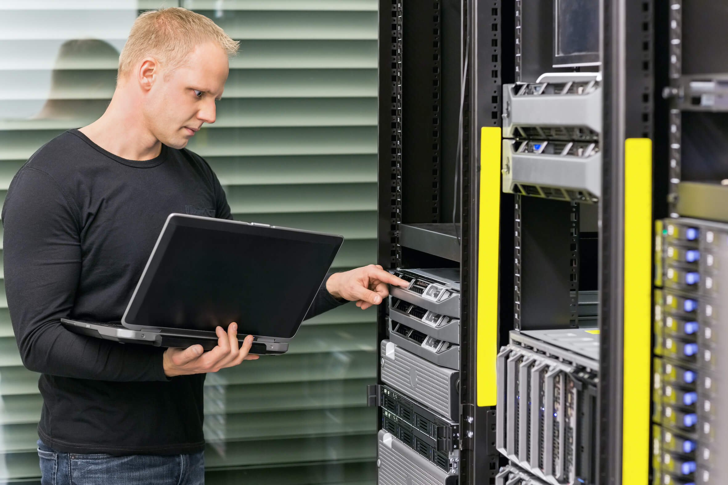 It consultant working with servers It consultant working with servers