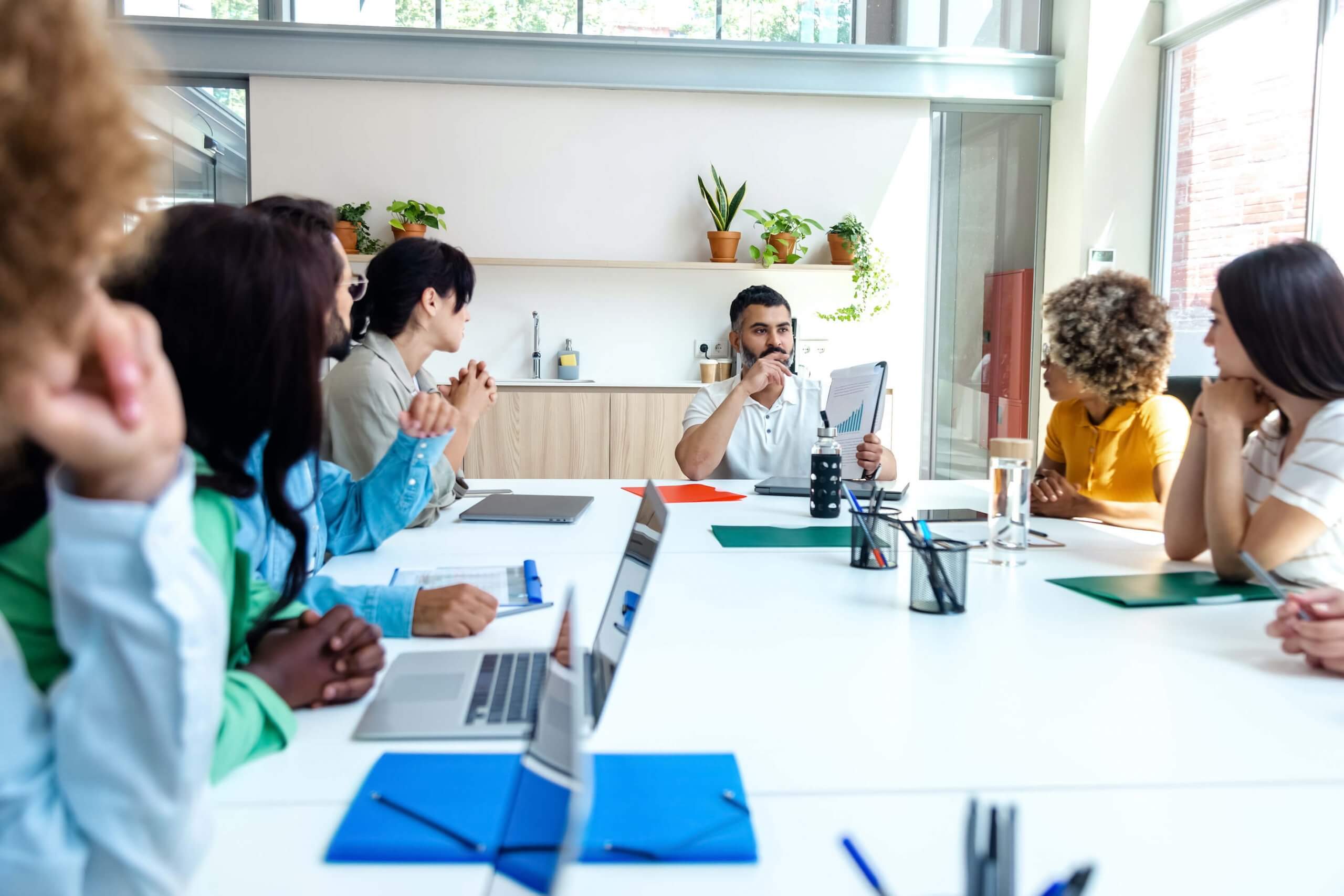multiracial-employees-listen-to-indian-boss-in-com-2022-11-02-12-22-59-utc multiracial-employees-listen-to-indian-boss-in-com-2022-11-02-12-22-59-utc